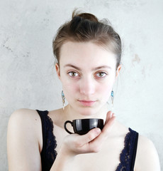 young Woman with hot cup ready for drinking