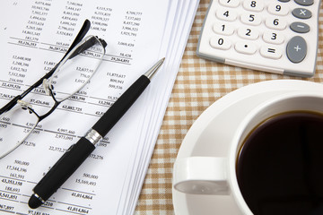 Business report and cup of coffee