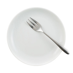 Metal fork in a ceramic plate isolated