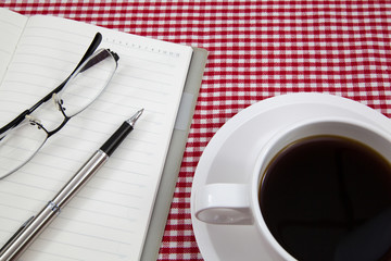 Cup of coffee and book