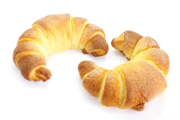 Fresh and tasty croissant over white background