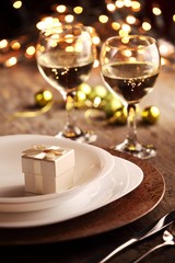 Plates, wine and Christmas decorations