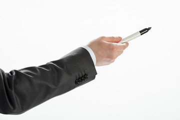 Businessman pointing at white wall, copy space