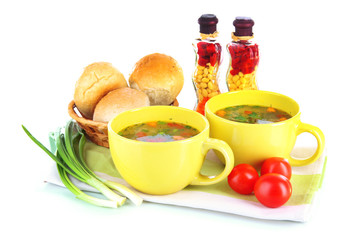 Fragrant soup in cups isolated on white