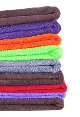 Pile of colorful towels, isolated on white