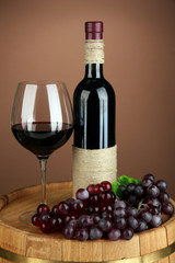 Composition of wine bottle, glass of red wine, grape