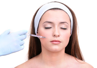 Young woman receiving plastic surgery injection