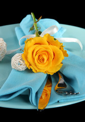 Served plate with napkin and flowers close-up