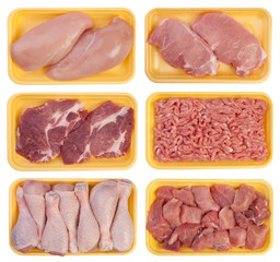Meat on trays isolated on white background