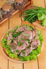 Chicken meat on wooden board,herbs and spices on wooden table
