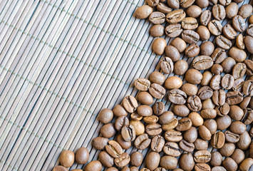 Coffee beans with bamboo background