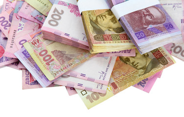 Obraz premium Pile of Ukrainian money, isolated on white