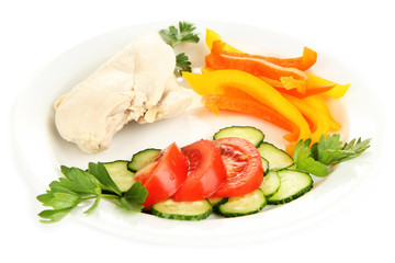 Boiled chicken breast on plate with vegetables close up