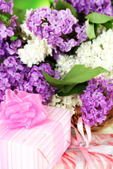 Beautiful lilac flowers with presents, close up