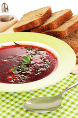 Delicious borsch on table close-up