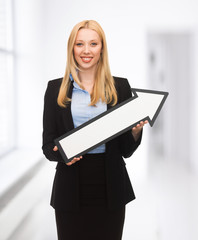 businesswoman with direction arrow sign