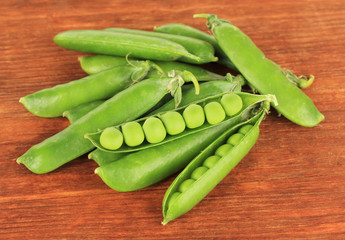 Sweet green peas on wooden background