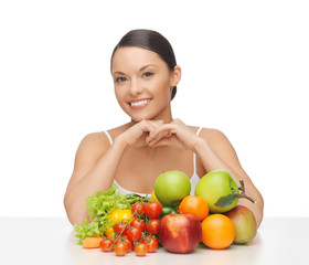 happy woman with lot of fruits and vegetables