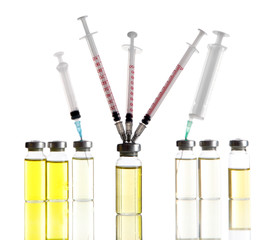 Medical bottles and syringes isolated on white