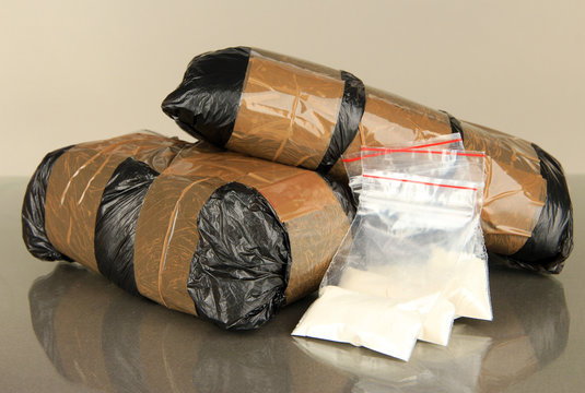 Packages of  narcotics on gray background