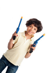Beautiful Mixed Race Boy Playing with Toy Guns