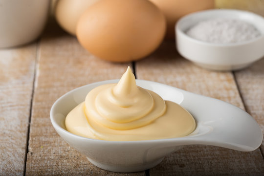 Mayonnaise in bowl on table