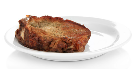 Piece of fried meat on plate isolated on white
