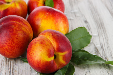 Peaches on wooden table