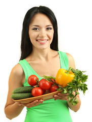 Girl with vegetables isolated on white