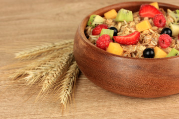 Oatmeal with fruits on table close-up