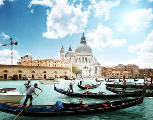 Fototapeta na wymiar gondolas on Canal and Basilica Santa Maria della Salute, Venice,