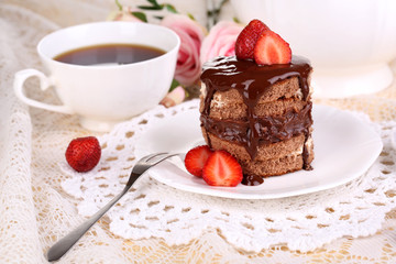 Chocolate cake with strawberry on table close-up