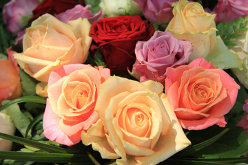 Pastel roses in bridal arrangement