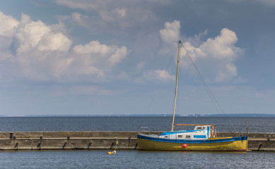 Blue and yellow boat on the Curonian Spit