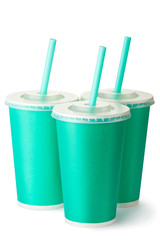 Three green cardboard cups with a straws