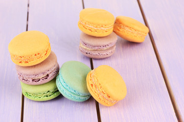 Macaroons on wooden table close-up