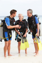 Senior Couple Having Scuba Diving Lesson With Instructor