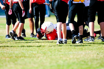 Youth football boy after tackle