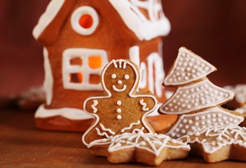 Gingerbread cookies and decorations. Focus on gingerbread man