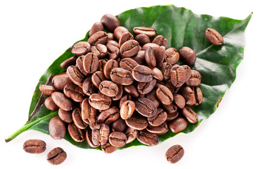 Coffee beans on leaf.