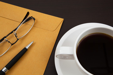 Cup of coffee and paper