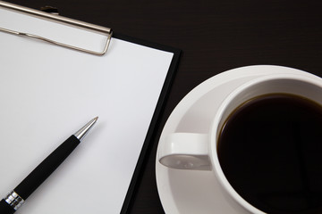 Cup of coffee and paper