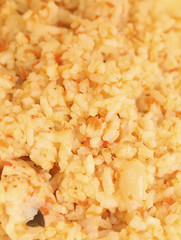 Cooked rice with tomato juice.