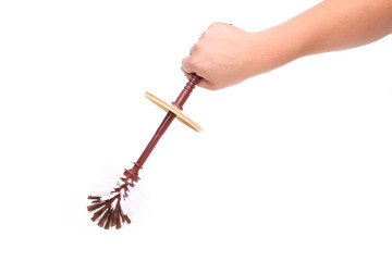toilet brush and a hand