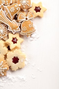 White wooden board and Christmas cookies.
