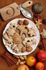 Table with cookies, apples spices and vintage cookie cutters