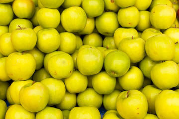 display of green apples to the market
