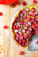 tart with fresh raspberries and cream, top view