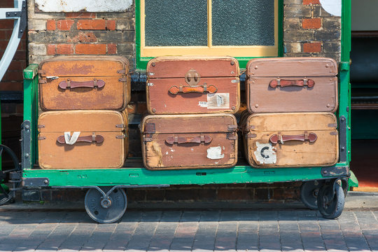 Vintage suitcases and trolley