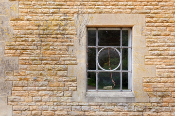 Old window set in limstone building